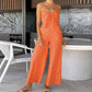 Trendy jumpsuit uten ermer med vidde i bena og slips foran