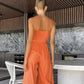 Trendy jumpsuit uten ermer med vidde i bena og slips foran