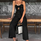 Trendy jumpsuit uten ermer med vidde i bena og slips foran