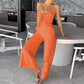 Trendy jumpsuit uten ermer med vidde i bena og slips foran
