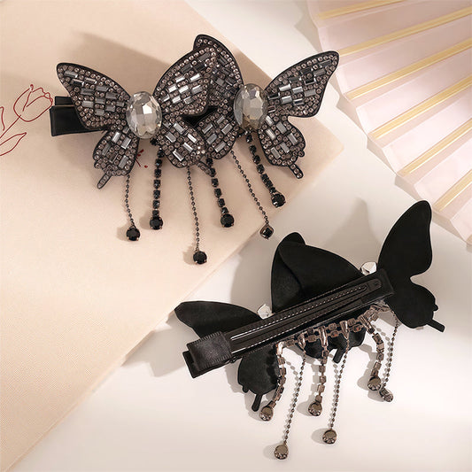 Stilig hårspenne med rhinestones og sommerfugl